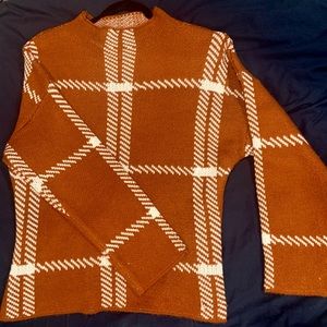 Cute rustic orange fall/winter knit sweater.
